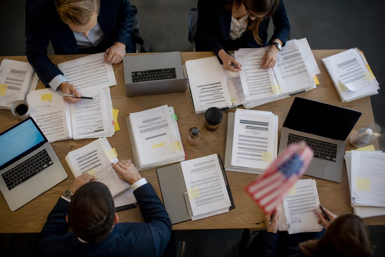 Capture planning table with laptops and documents
